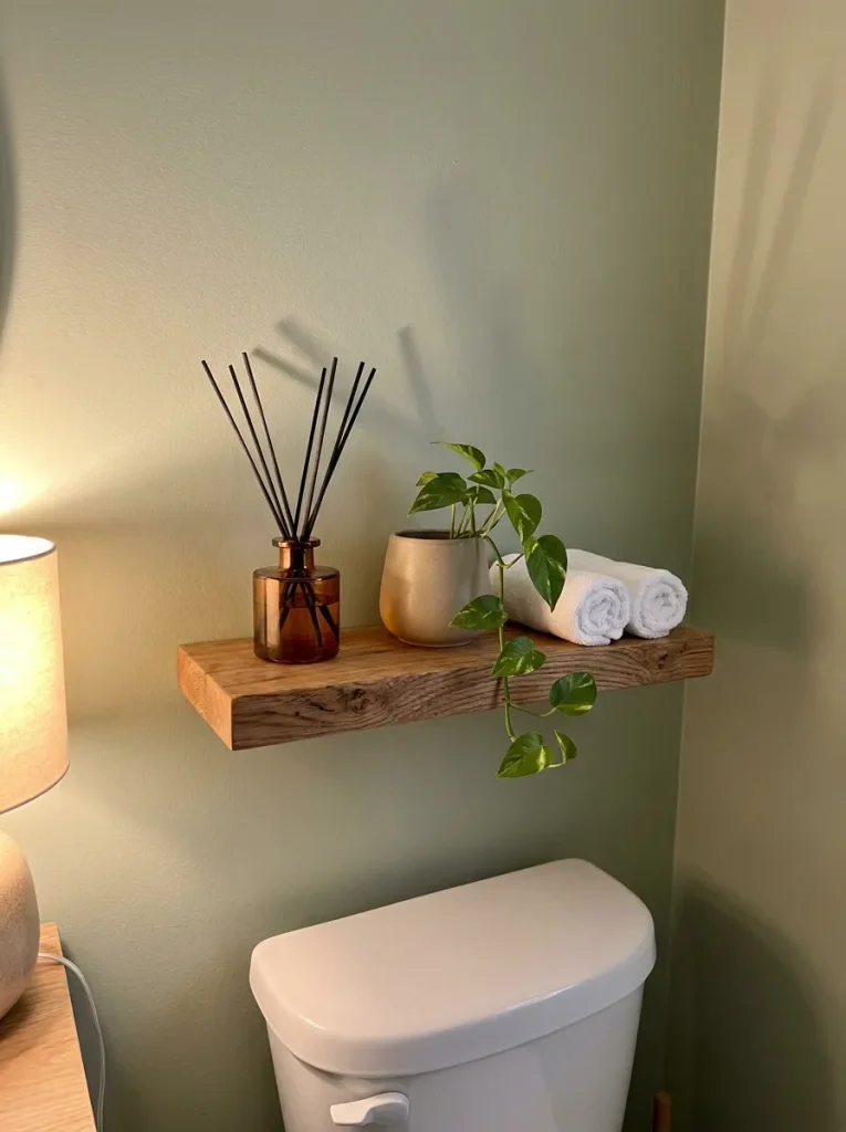 Floating shelf above toilet