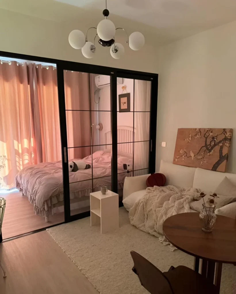 Close Off the Bed With Black-Framed Glass Sliders