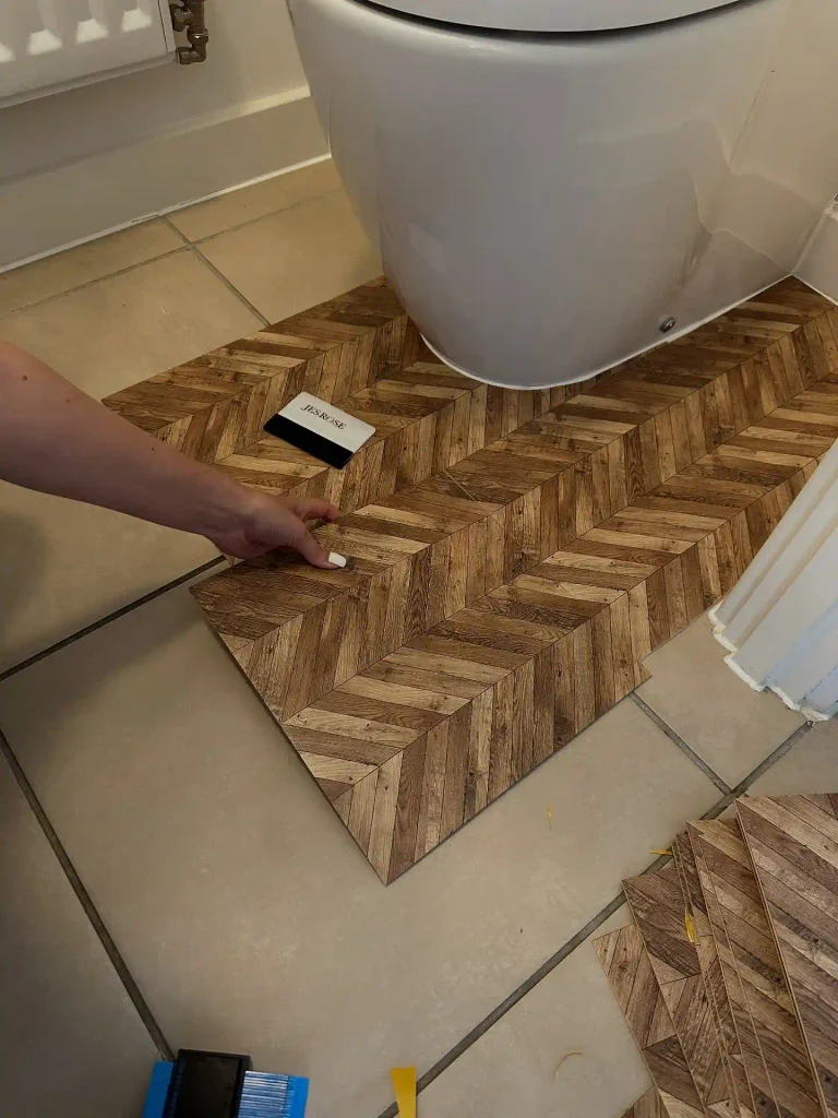Stick Wood-Look Chevron Tiles Right Over Bathroom Tile
