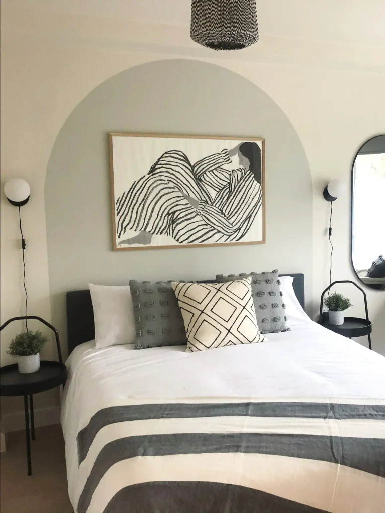 Paint an Arch Behind the Bed and Hang One Big Print Inside It